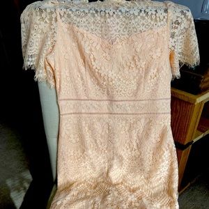 Beautiful dress for many occasions. The color is a faint peach!